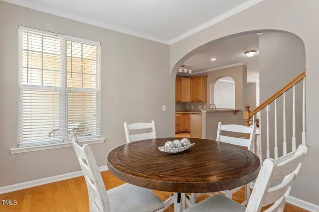 a view of a dining room with furniture and a window