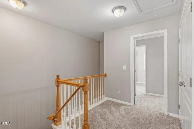 a view of a hallway with staircase