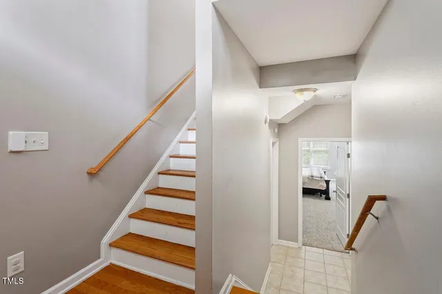a view of entryway and hall with wooden floor