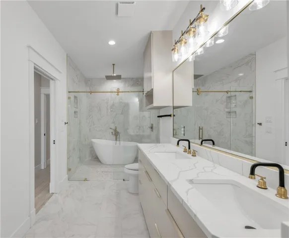a bathroom with a double vanity sink and a mirror