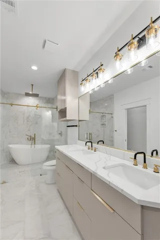 a bathroom with a double vanity sink and a mirror