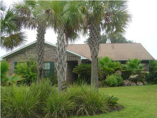 2518 Valley Road Navarre, FL 32566 - Photo 1 of 8 a backyard of a house with lots of green space