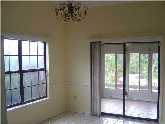 2518 Valley Road Navarre, FL 32566 - Photo 8 of 8 a view of empty room with wooden floor and fan