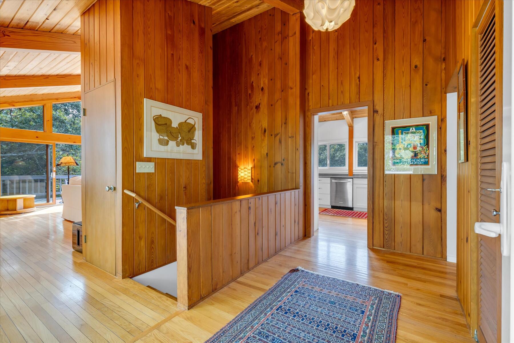 19 Avery Way Truro, MA 02666 - Photo 11 of 50 a view of a hallway with wooden floor and windows