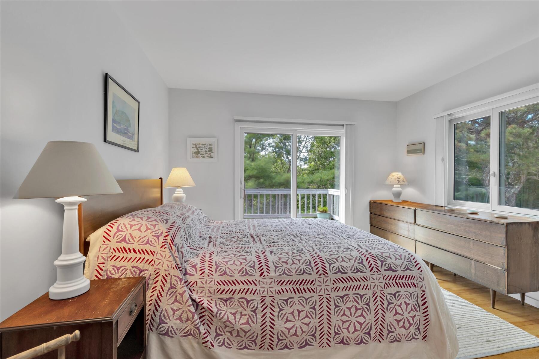 19 Avery Way Truro, MA 02666 - Photo 26 of 50 a bedroom with a large bed and a large window