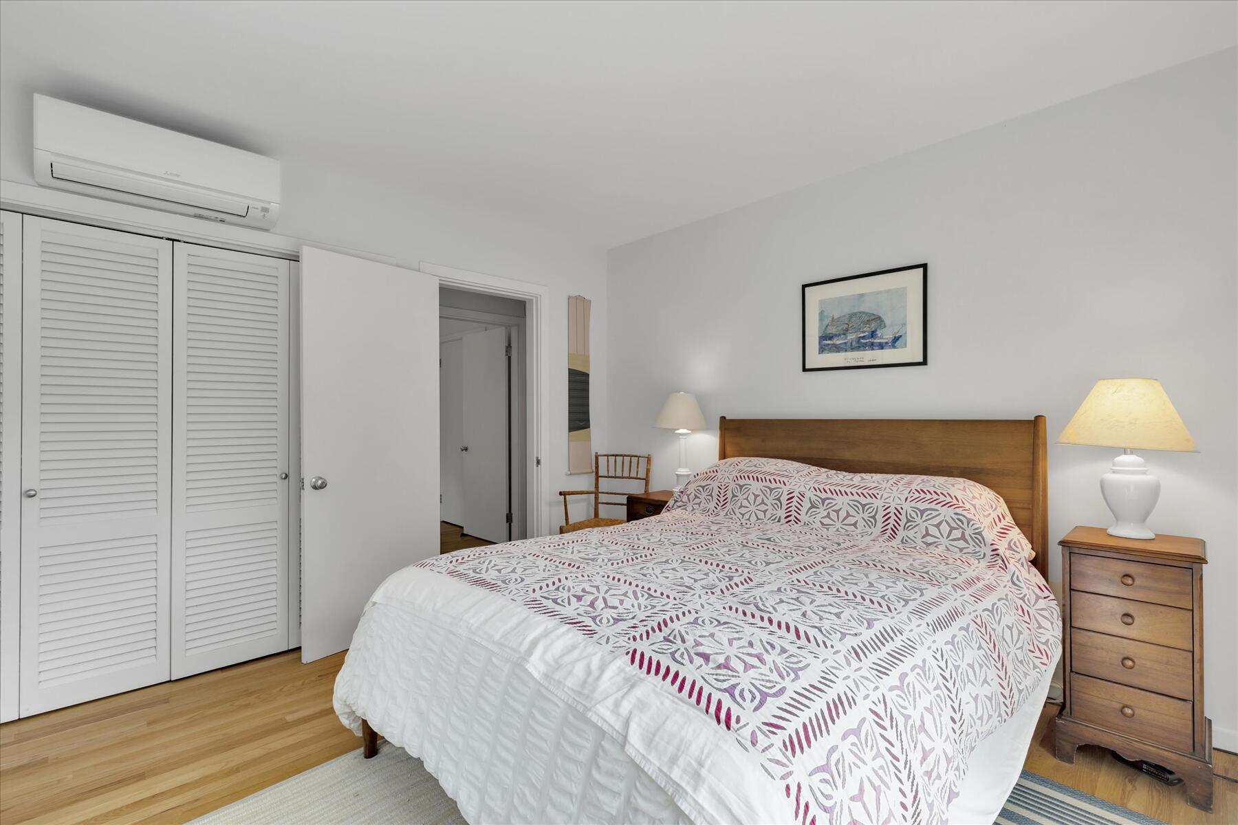 19 Avery Way Truro, MA 02666 - Photo 28 of 50 a bedroom with a bed and a lamp on dresser