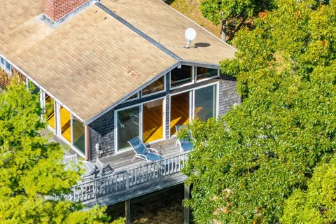 a front view of house with yard and seating area