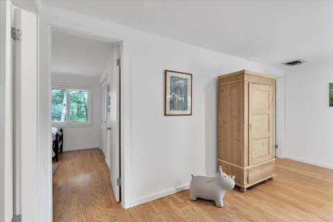 a view of livingroom with hardwood floor and bedroom