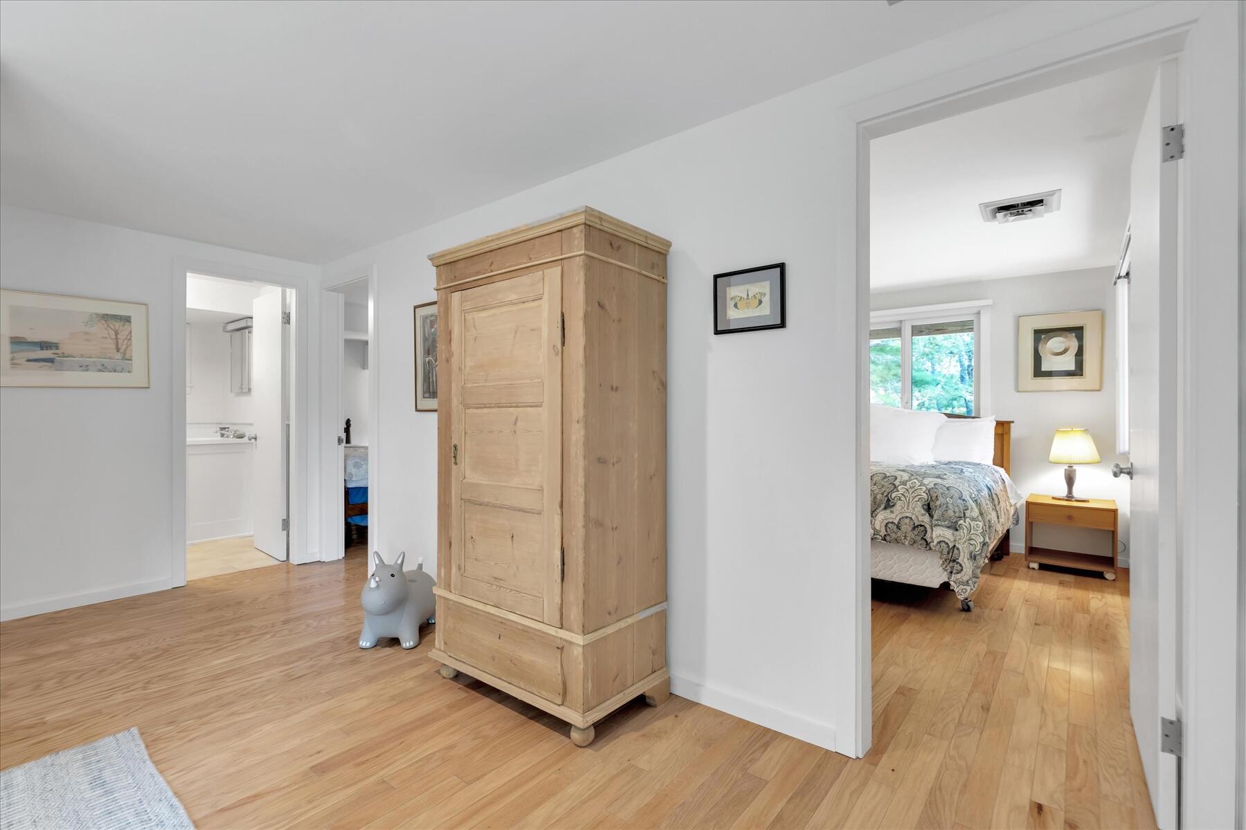 19 Avery Way Truro, MA 02666 - Photo 34 of 50 a view of livingroom with hardwood floor and bedroom