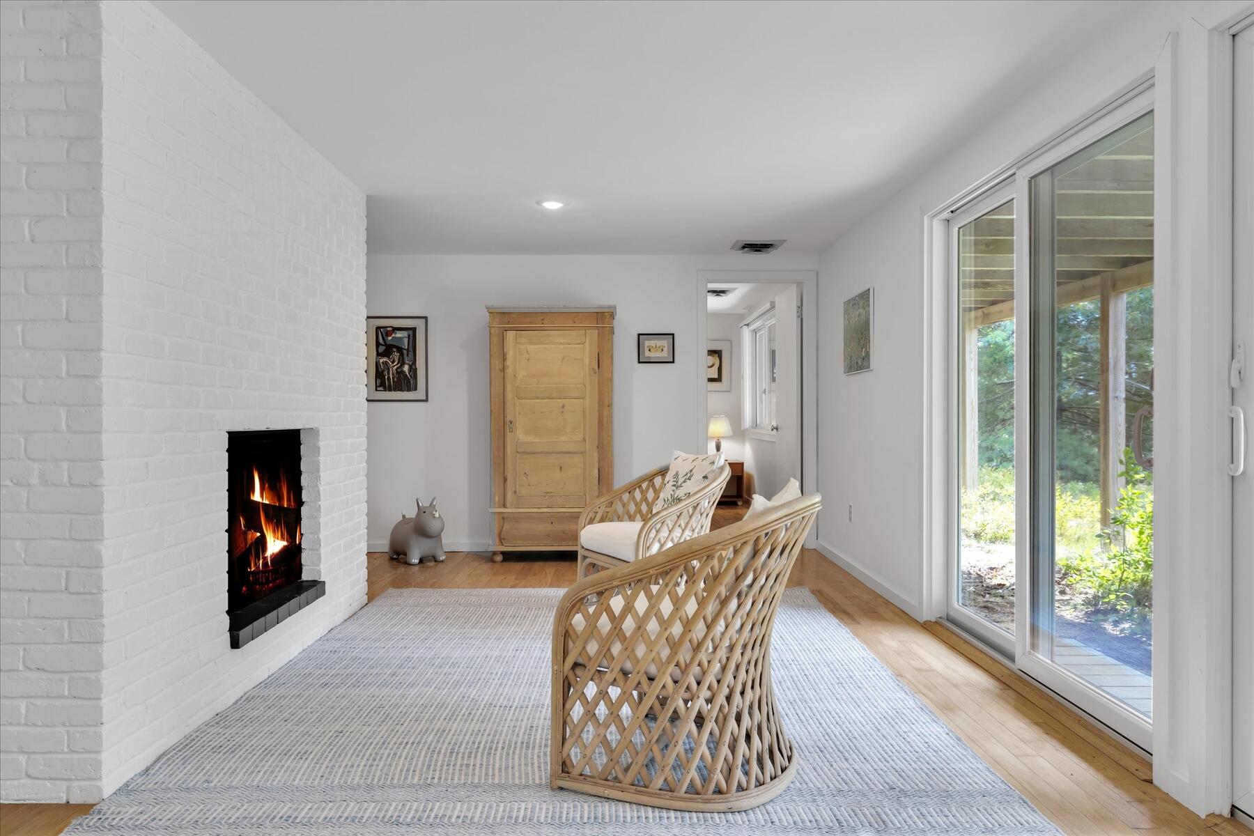 19 Avery Way Truro, MA 02666 - Photo 35 of 50 a living room with furniture and a fireplace