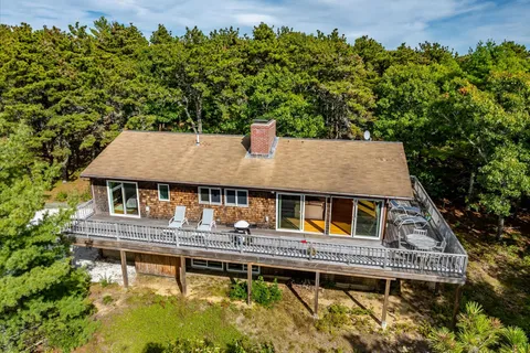 aerial view of a house with swimming pool and porch