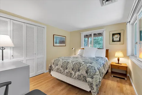 a bedroom with a bed and window