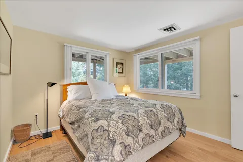 a view of a wooden door with a tree