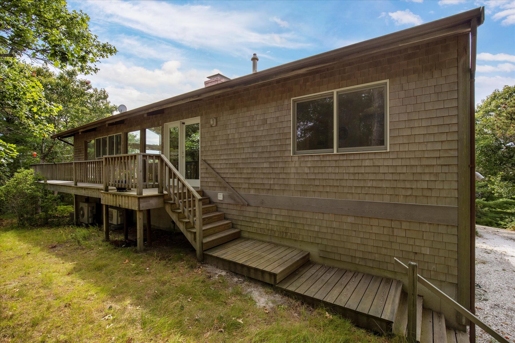 19 Avery Way Truro, MA 02666 - Photo 8 of 50 a view of a backyard with sitting area