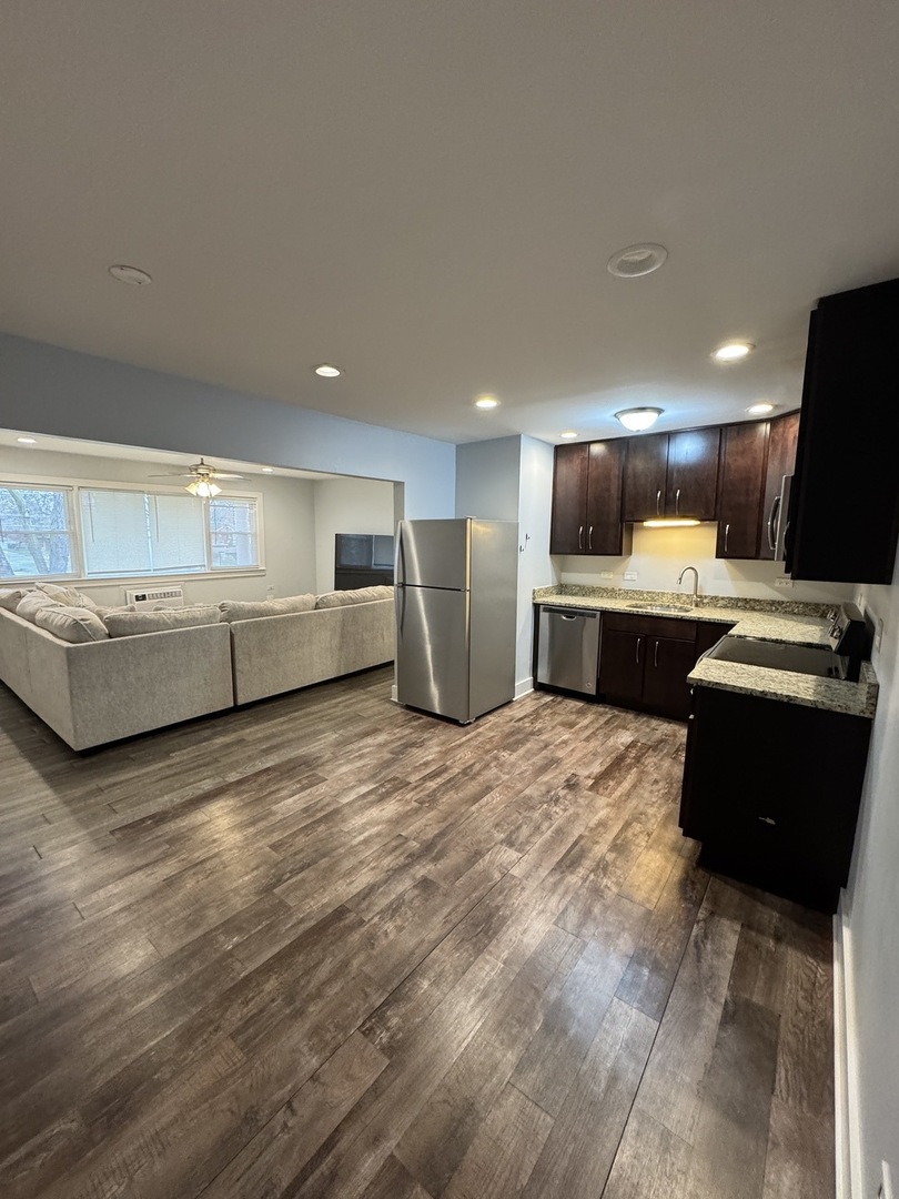 1443 Homestead Road, Unit 2NW La Grange Park, IL 60526 - Photo 4 of 13 a living room with furniture and a flat screen tv