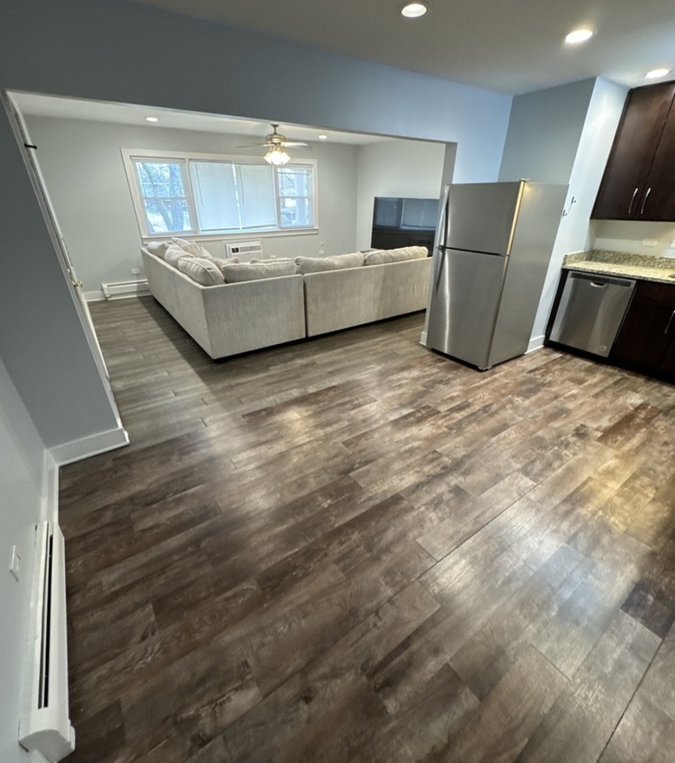 1443 Homestead Road, Unit 2NW La Grange Park, IL 60526 - Photo 8 of 13 a living room with furniture and a flat screen tv