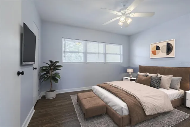 a bedroom with bed and a window