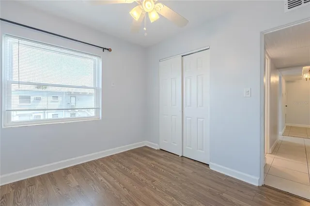 a living room with a balcony and furniture