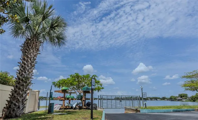 a swimming pool with outdoor seating and yard
