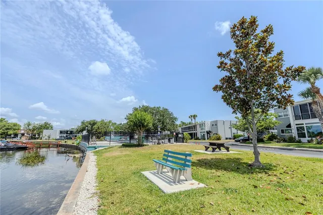 a view of a lake with houses in the back