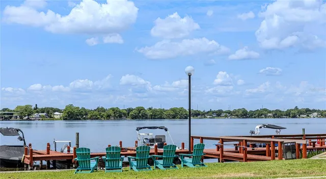 a view of a swimming pool and lounge chairs