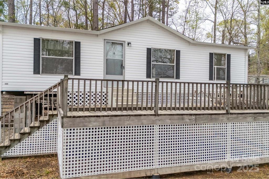2342 Beaver Creek Road Camden, SC 29020 - Photo 4 of 26 a view of a brick house with wooden fence