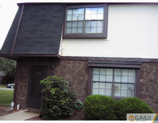 8501 Hana Road Edison, NJ 08817 - Photo 2 of 10 a front view of a house with a garage