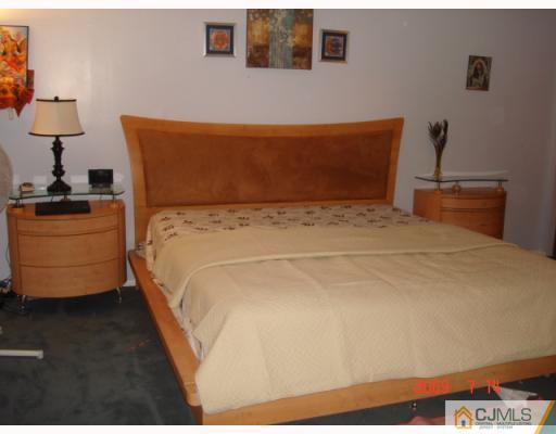 8501 Hana Road Edison, NJ 08817 - Photo 3 of 10 a bedroom with bed and window