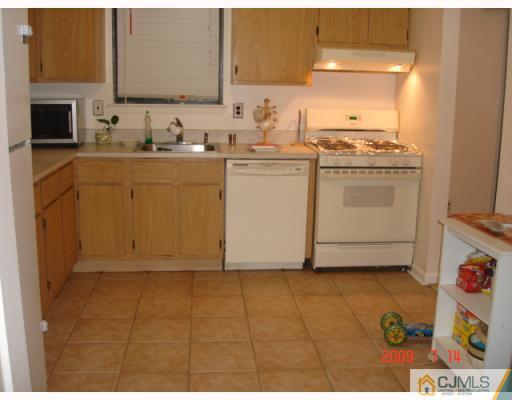 8501 Hana Road Edison, NJ 08817 - Photo 5 of 10 a utility room with sink dryer and washer