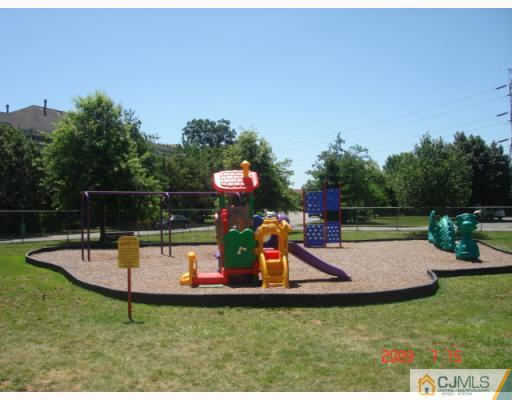 8501 Hana Road Edison, NJ 08817 - Photo 8 of 10 a view of a backyard with swimming pool and sitting area