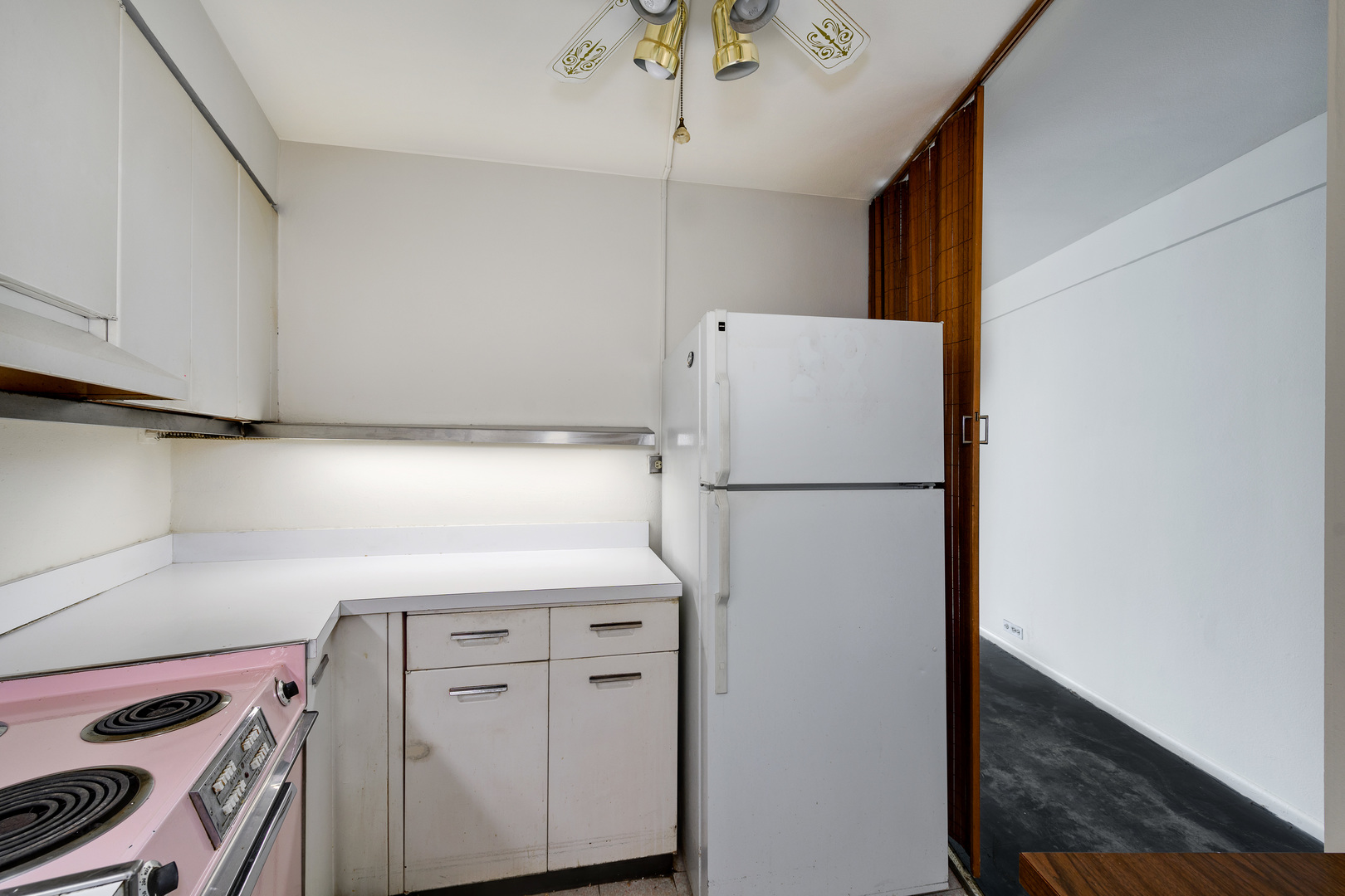 300 North State Street, Unit 3128 Chicago, IL 60654 - Photo 6 of 20 a white refrigerator freezer sitting inside of a kitchen