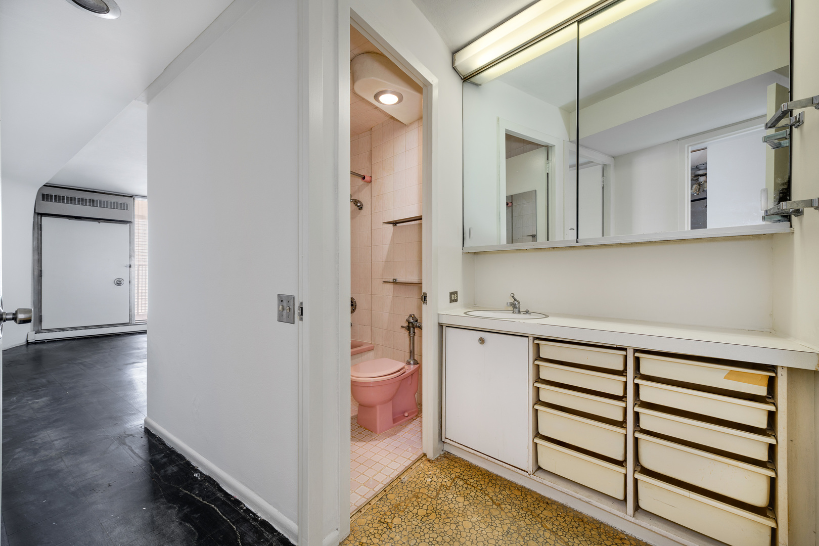 300 North State Street, Unit 3128 Chicago, IL 60654 - Photo 7 of 20 a bathroom with a sink and a mirror