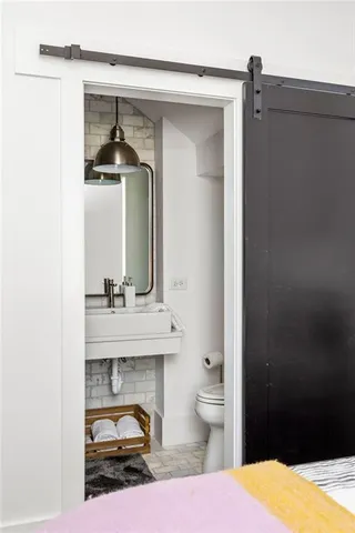 a bathroom with a sink a mirror and a shower