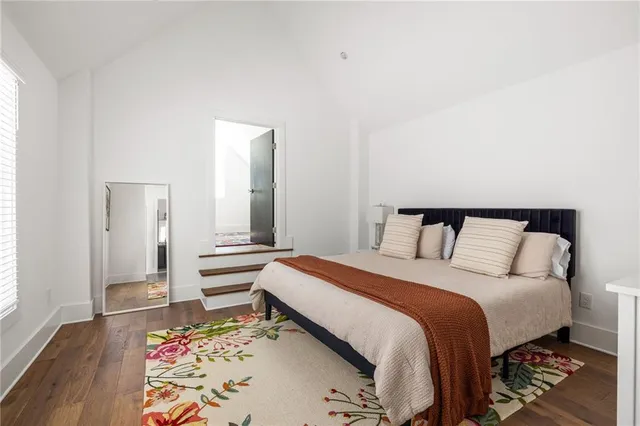 a bed room with a bed and a television