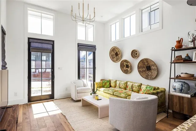 a living room with fireplace furniture and a window