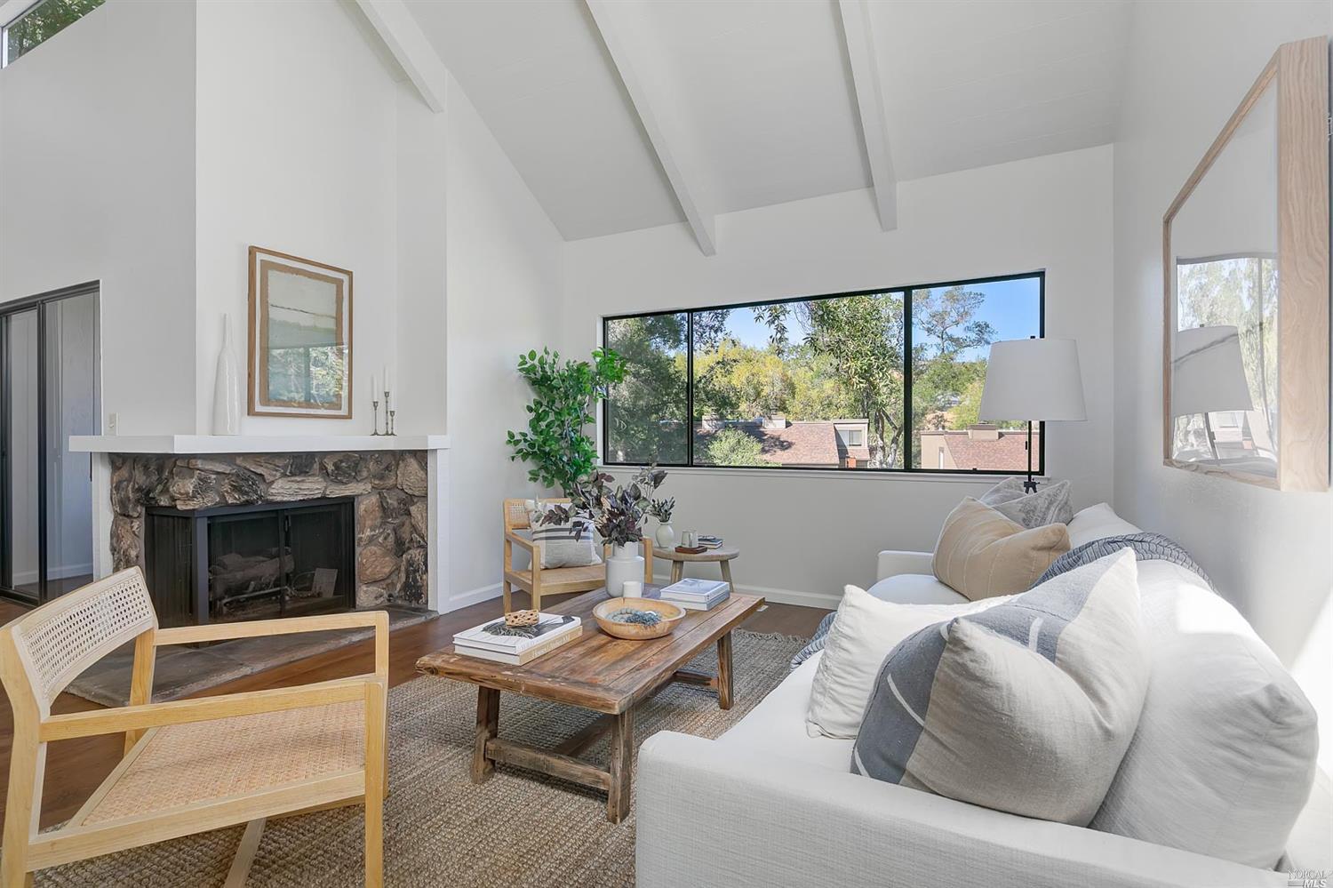 310 Indian Way Novato, CA 94949 - Photo 1 of 1 a living room with furniture and a fireplace