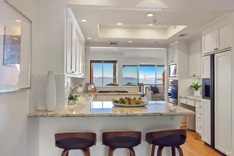 a kitchen with a sink cabinets and window