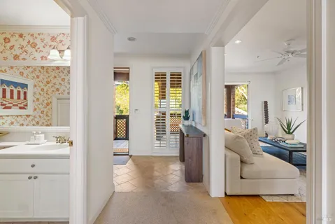 a view of a living room and a large window