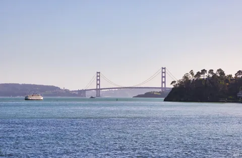 a view of lake with mountain in the background