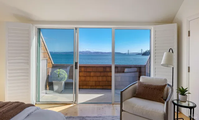 a bedroom with a bed and a mirror