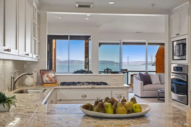 a living room with furniture and a sink