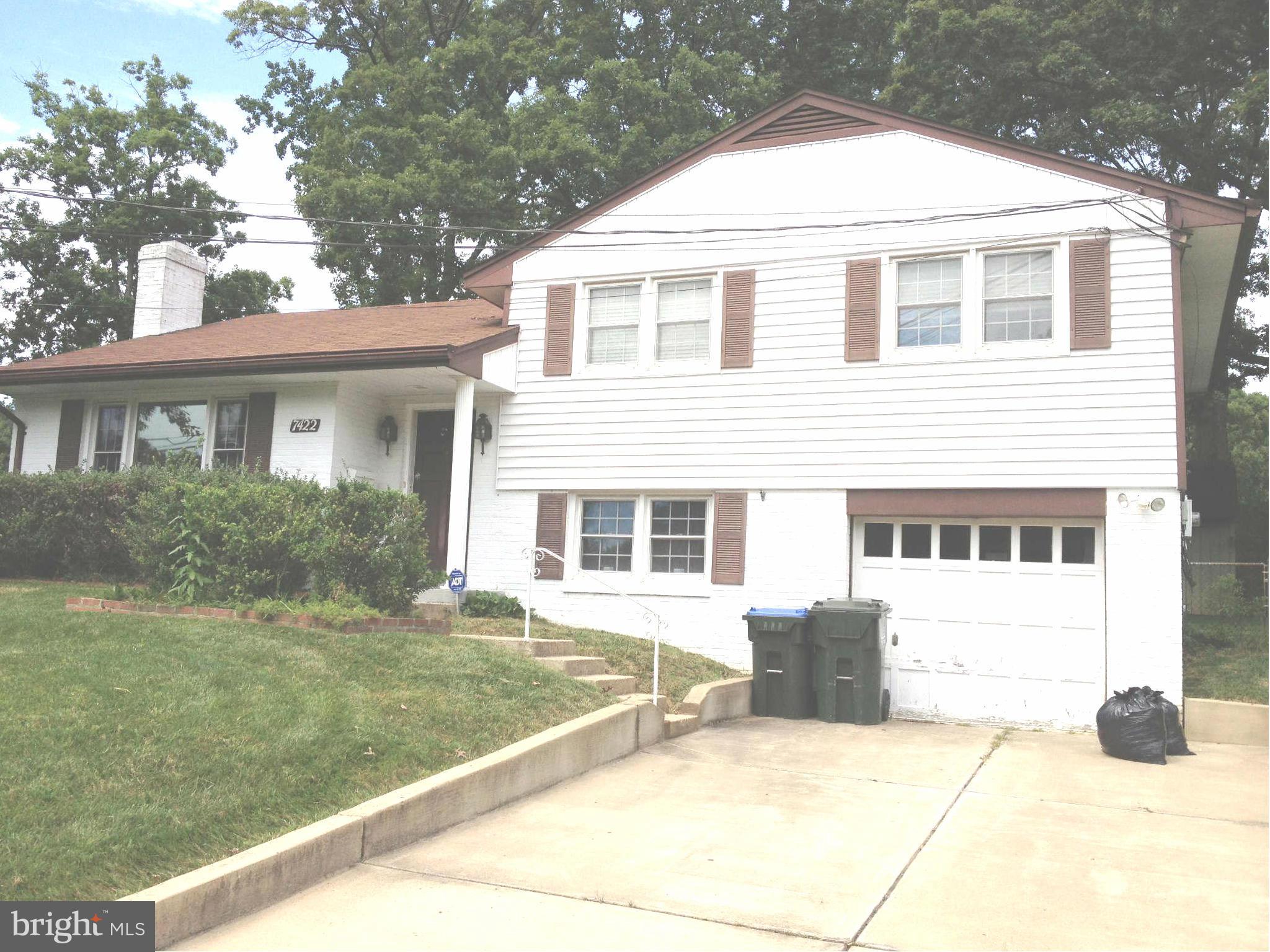 7422 Chatham Street Springfield, VA 22151 - Photo 1 of 30 a front view of a house with a yard