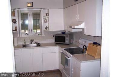 7422 Chatham Street Springfield, VA 22151 - Photo 11 of 30 a kitchen with a sink and cabinets
