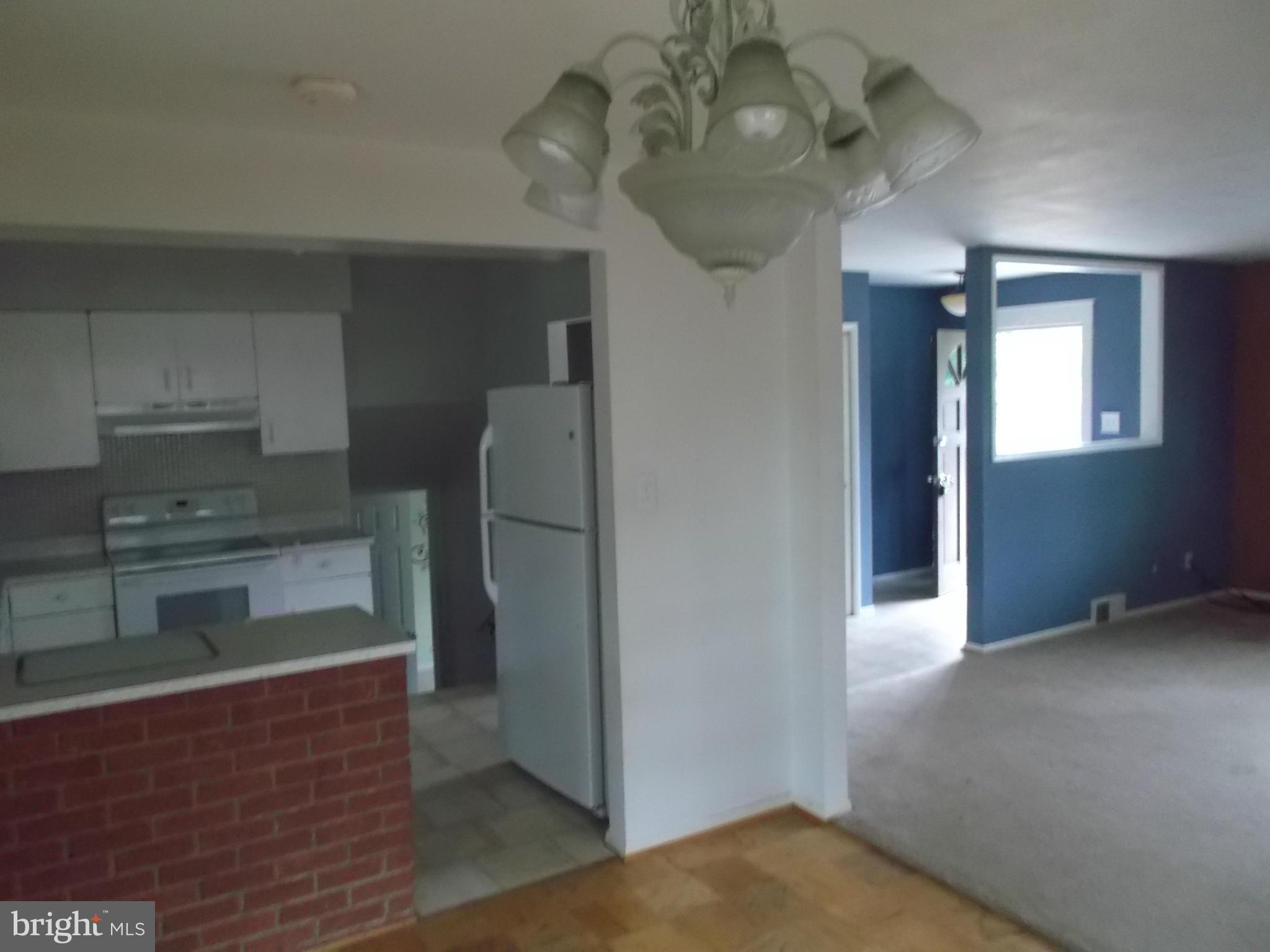 7422 Chatham Street Springfield, VA 22151 - Photo 14 of 30 a view of a kitchen cabinets and a refrigerator
