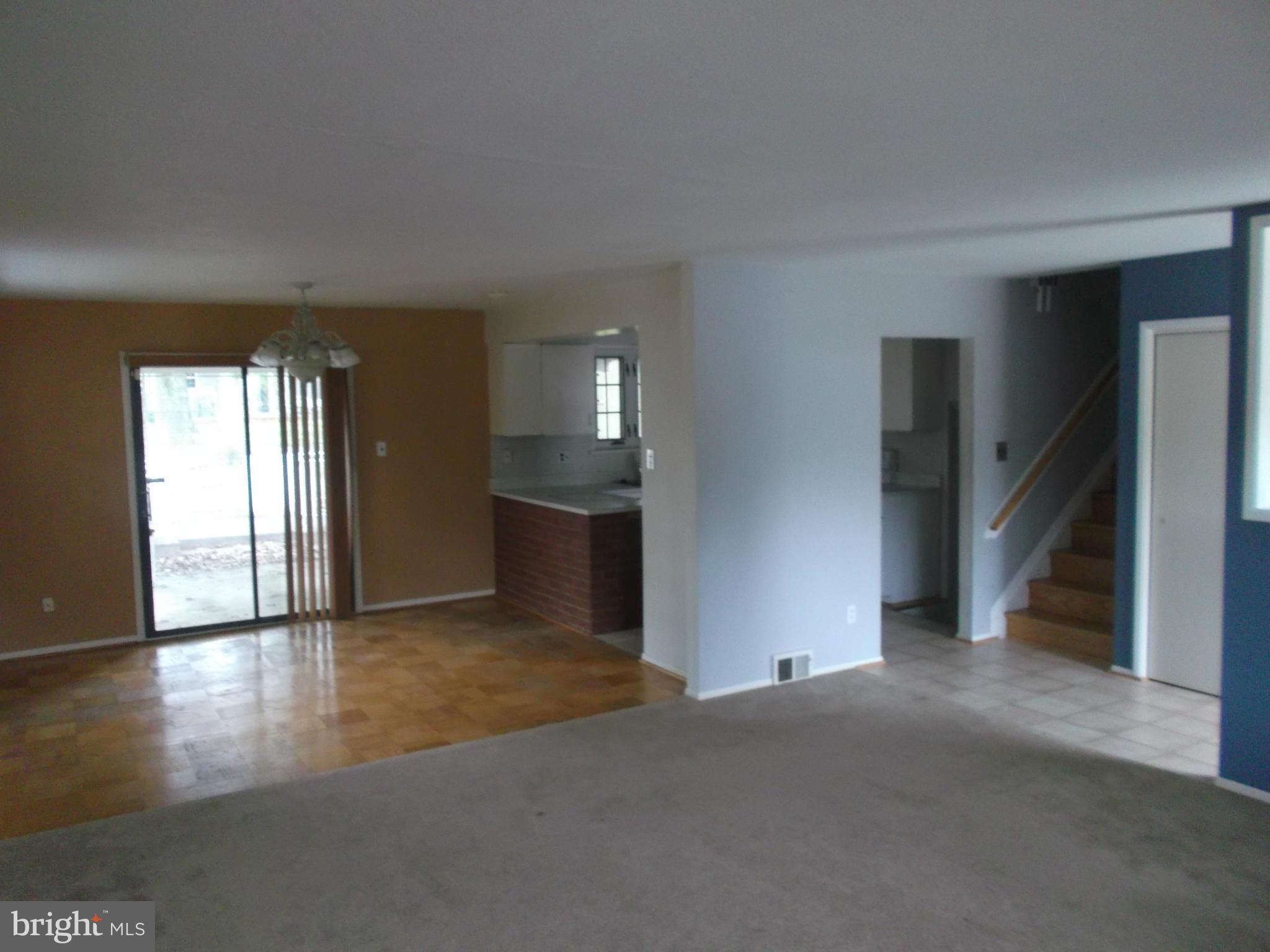 7422 Chatham Street Springfield, VA 22151 - Photo 22 of 30 an empty room with wooden floor and windows