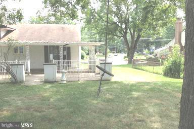 7422 Chatham Street Springfield, VA 22151 - Photo 25 of 30 a view of a house with a yard and sitting area
