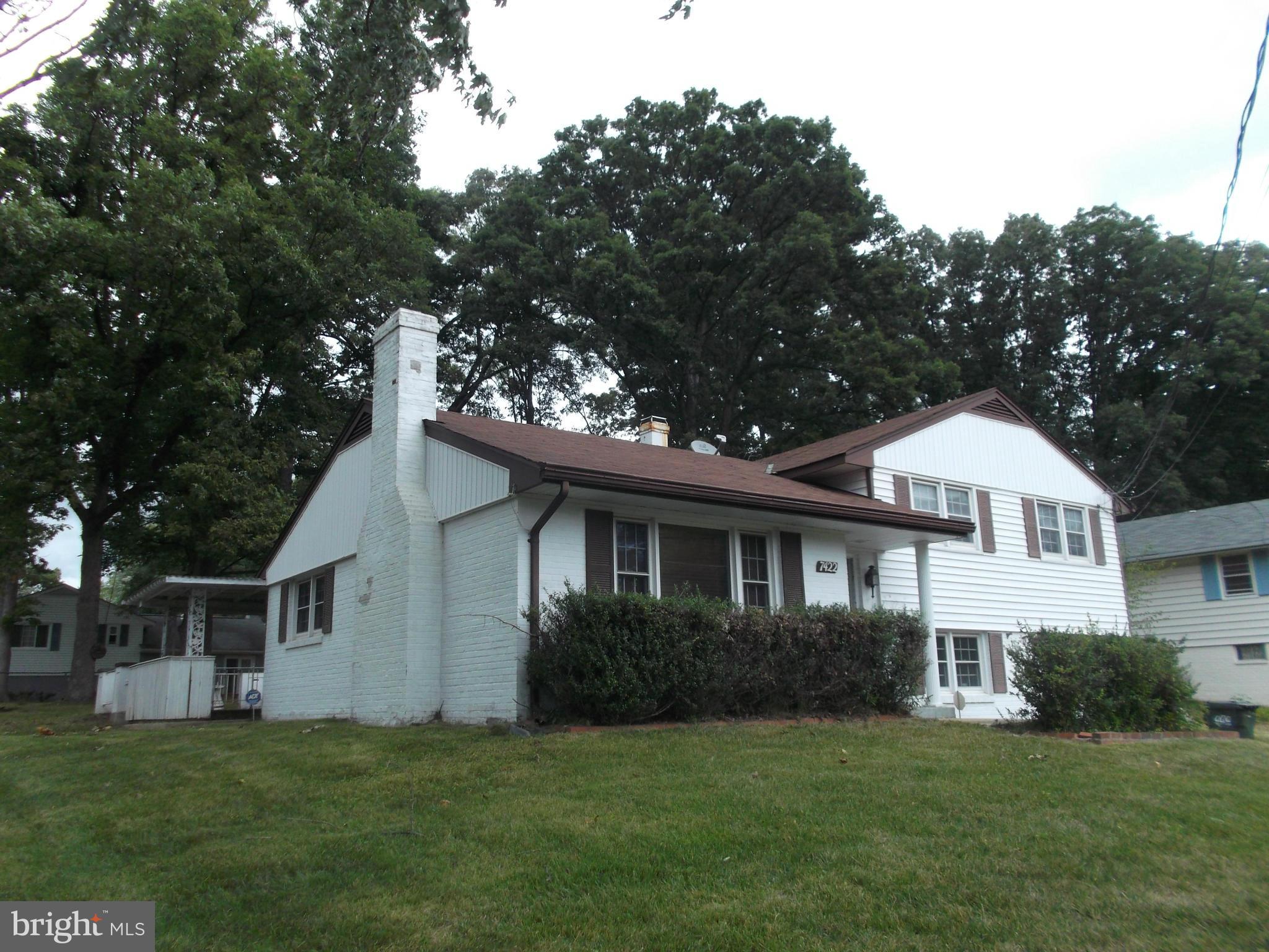 7422 Chatham Street Springfield, VA 22151 - Photo 30 of 30 a front view of a house with a garden