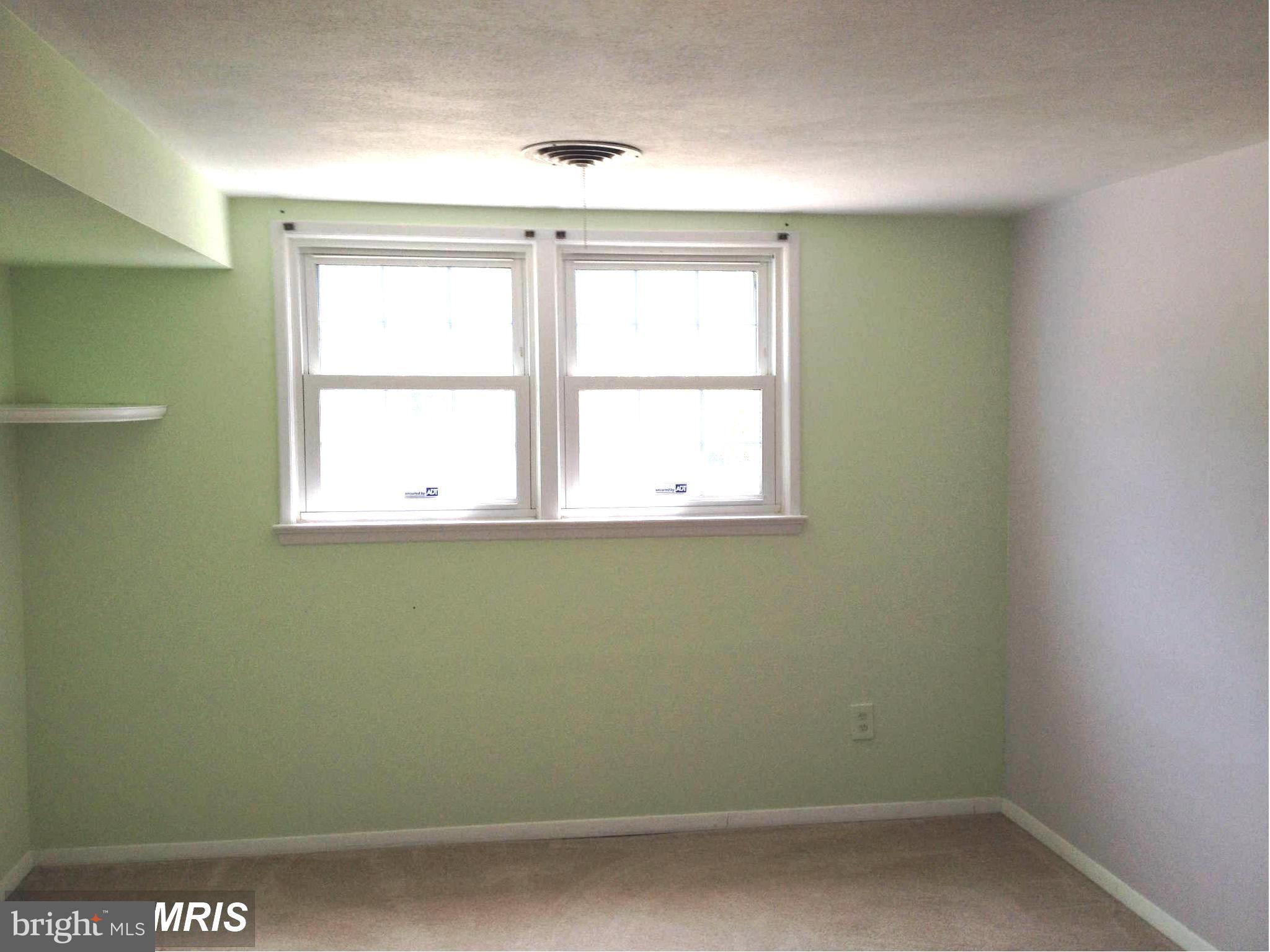 7422 Chatham Street Springfield, VA 22151 - Photo 7 of 30 an empty room with a window