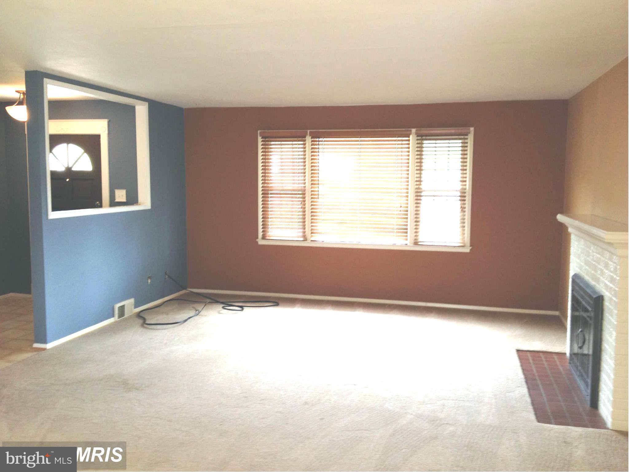 7422 Chatham Street Springfield, VA 22151 - Photo 8 of 30 a view of an empty room with a window