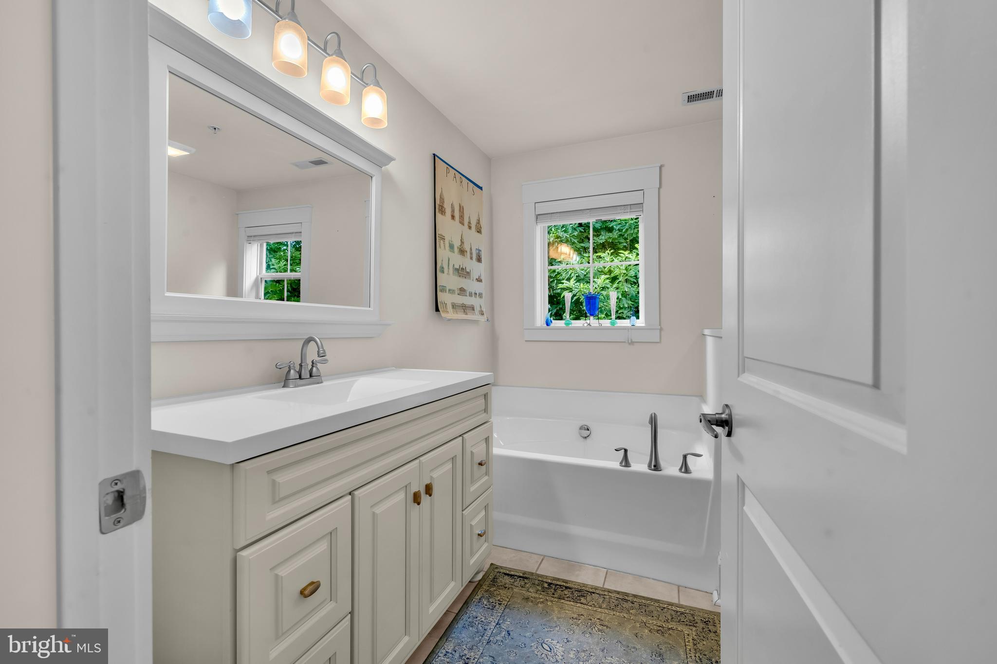 321 Front Street Crumpton, MD 21628 - Photo 28 of 59 a bathroom with a sink and a bathtub
